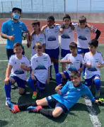 Photo about a futebol team of kids, with the Ilhapeixe logo on their t-shirts.